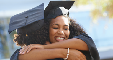 BEP Partnership image of two graduates hugging