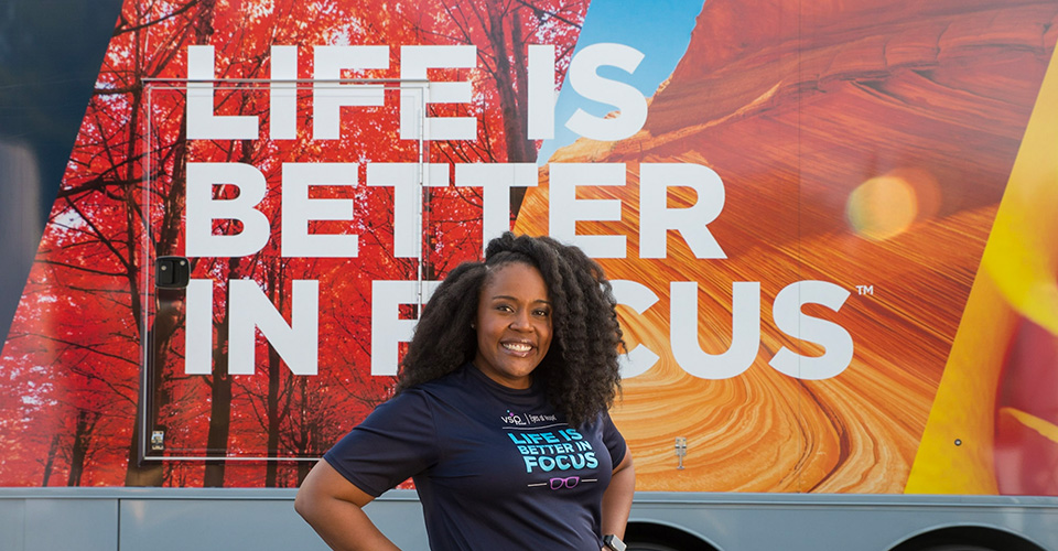 Torreyana Tripette as an MRT in front of the Eyes of Hope Mobile Clinic